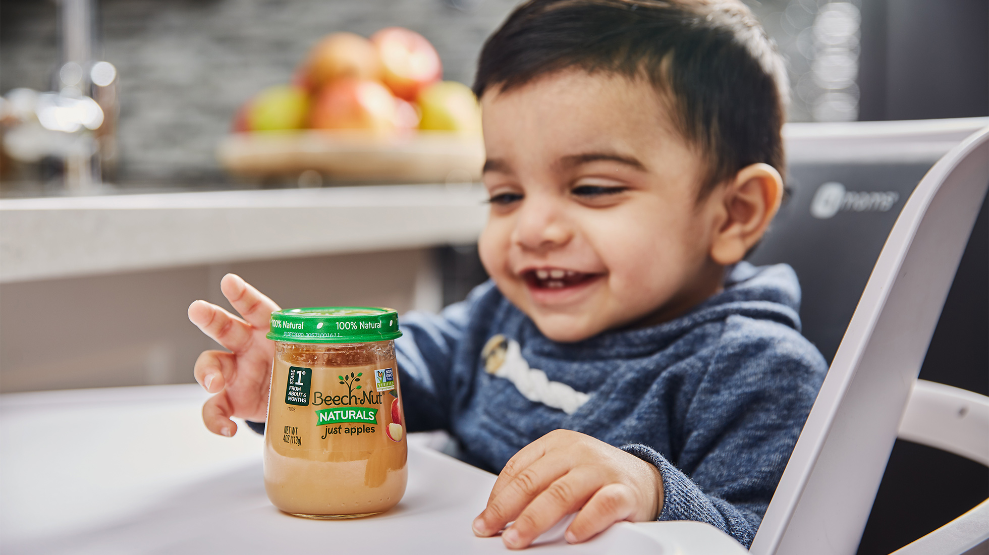 Infant enjoying Beech Nut Natural baby food