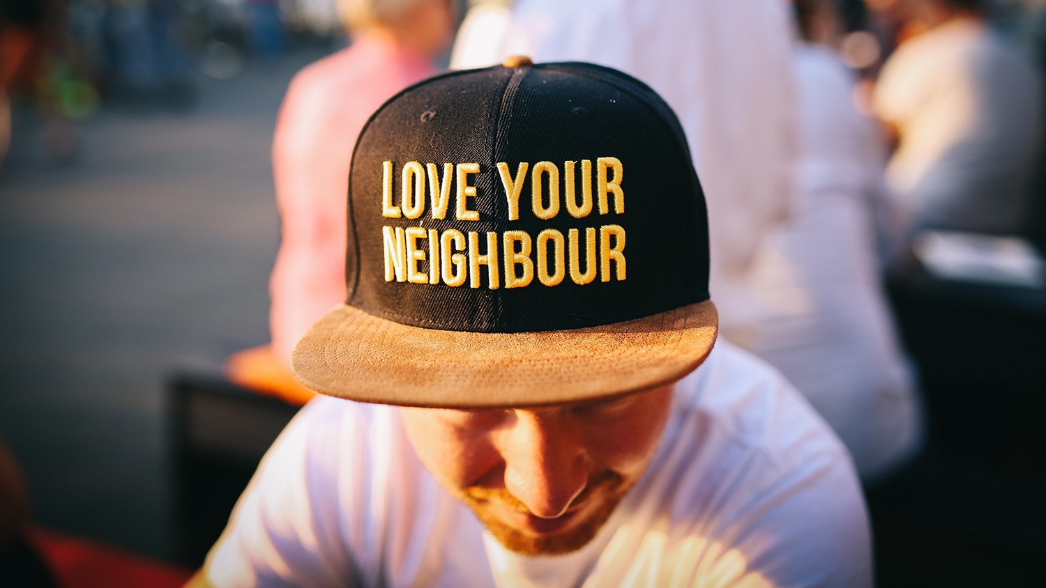 Love your neighbor hat on man